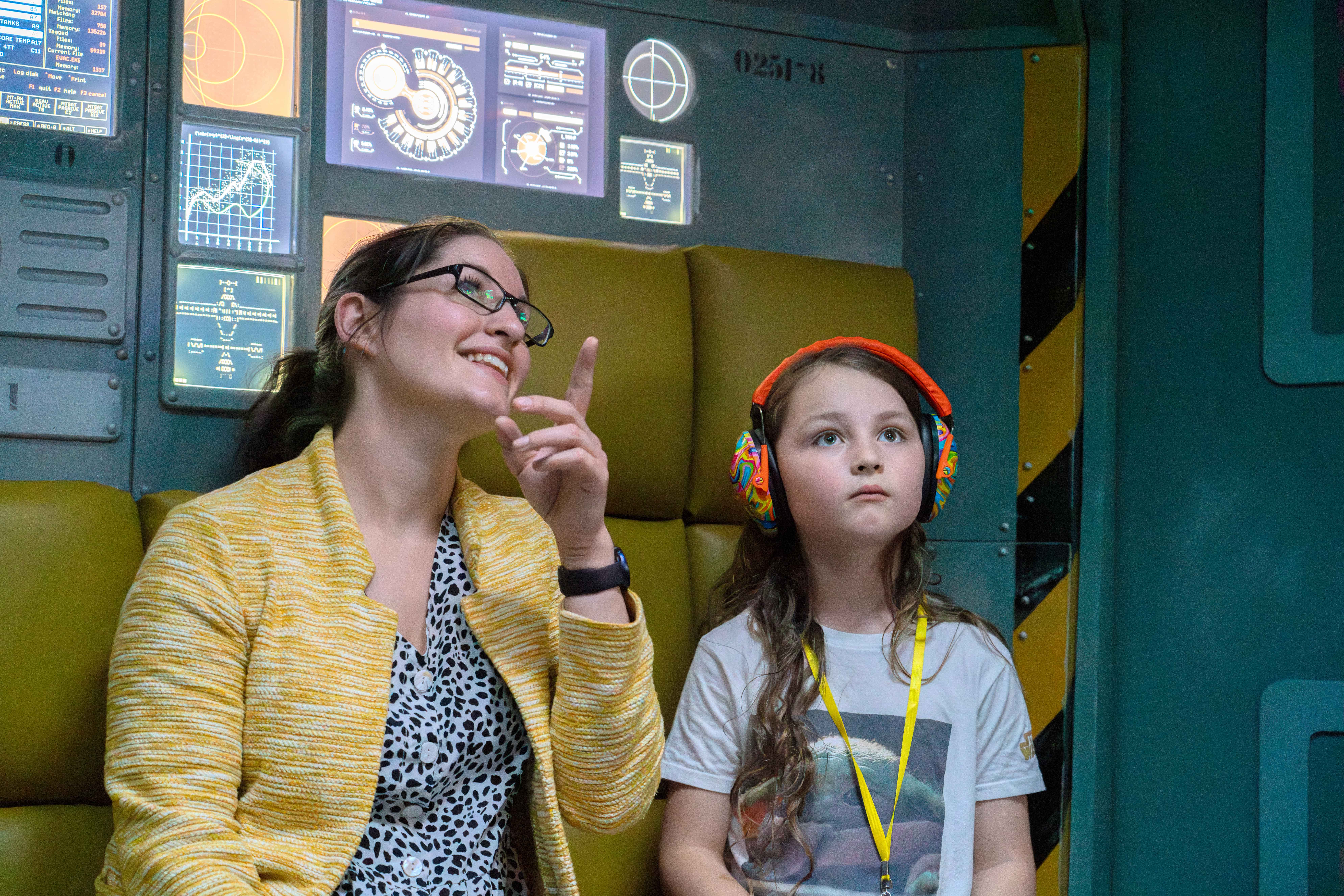 Mother and child with ear defenders in Tetrastar on an Accessible Afternoon